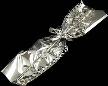 A Single Platinum dipped Rose wrapped in silver cellophame and bow!